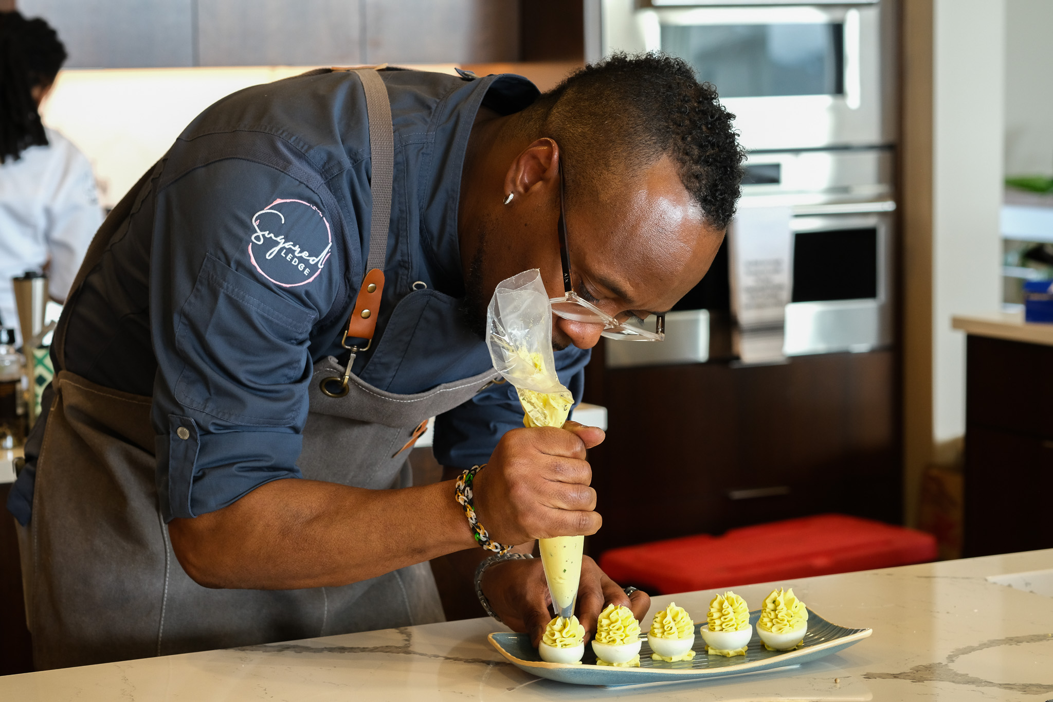 a man cutting food on a table