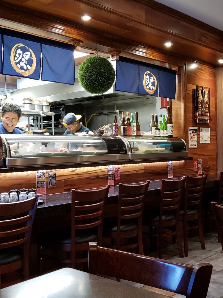 a kitchen with a table in a restaurant