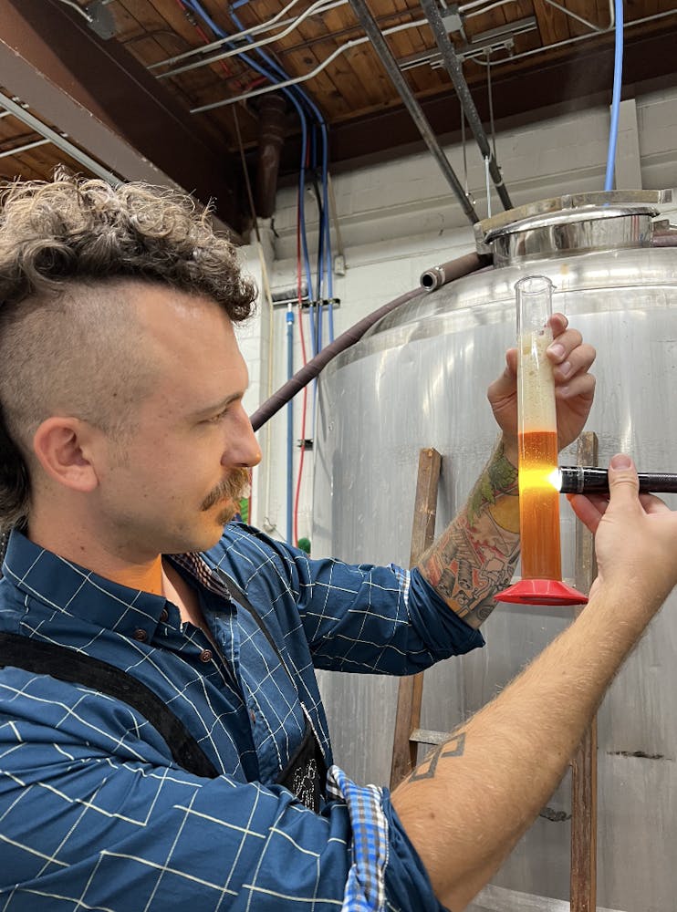 a man holding a wine glass