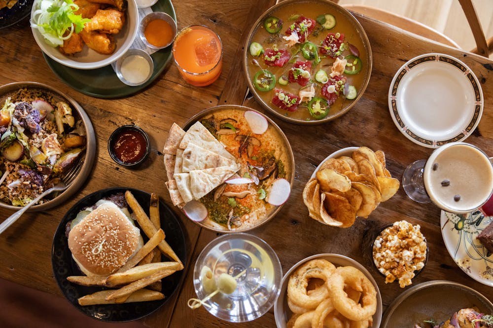 a bunch of food sitting on top of a wooden table