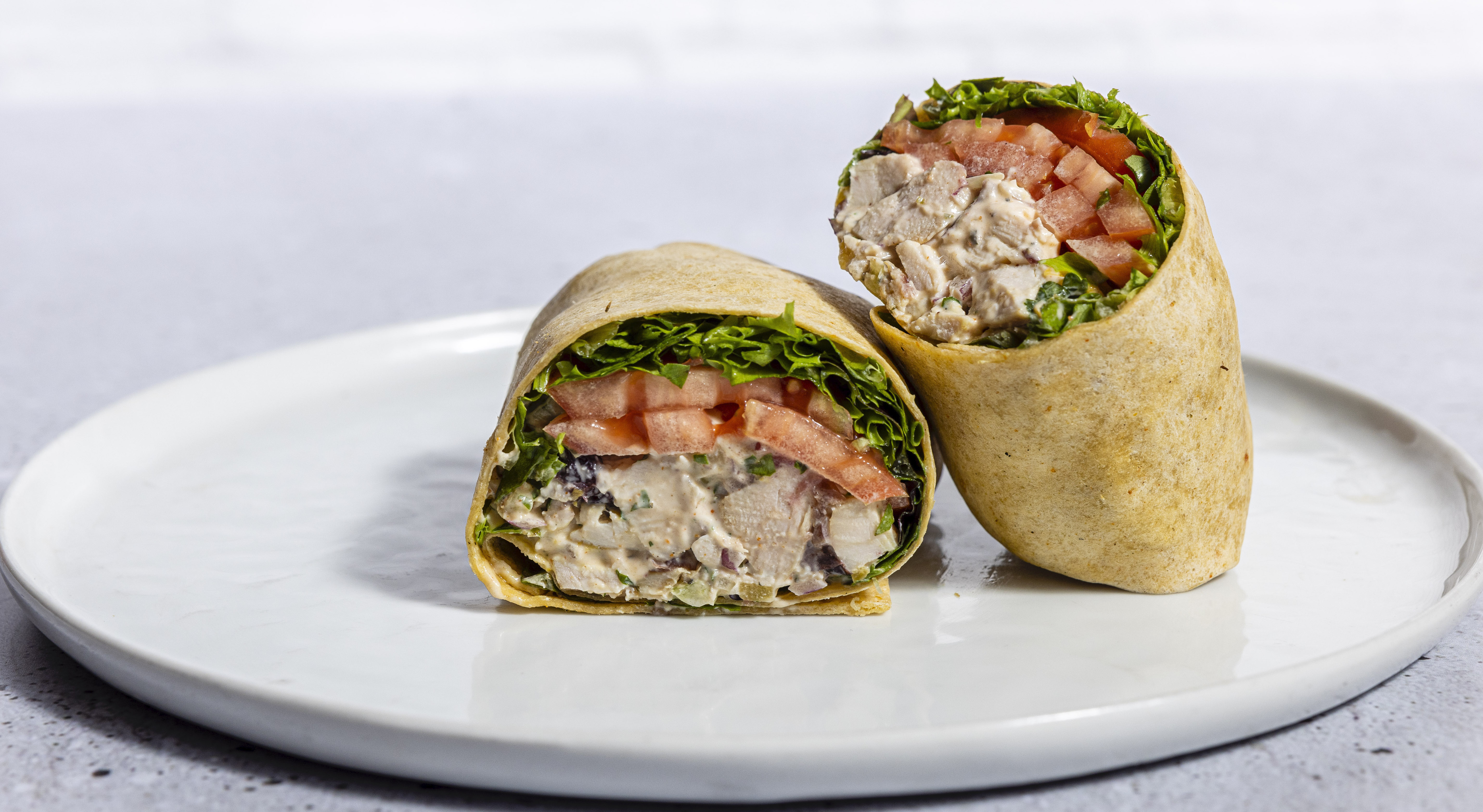 a sandwich sitting on top of a plate of food