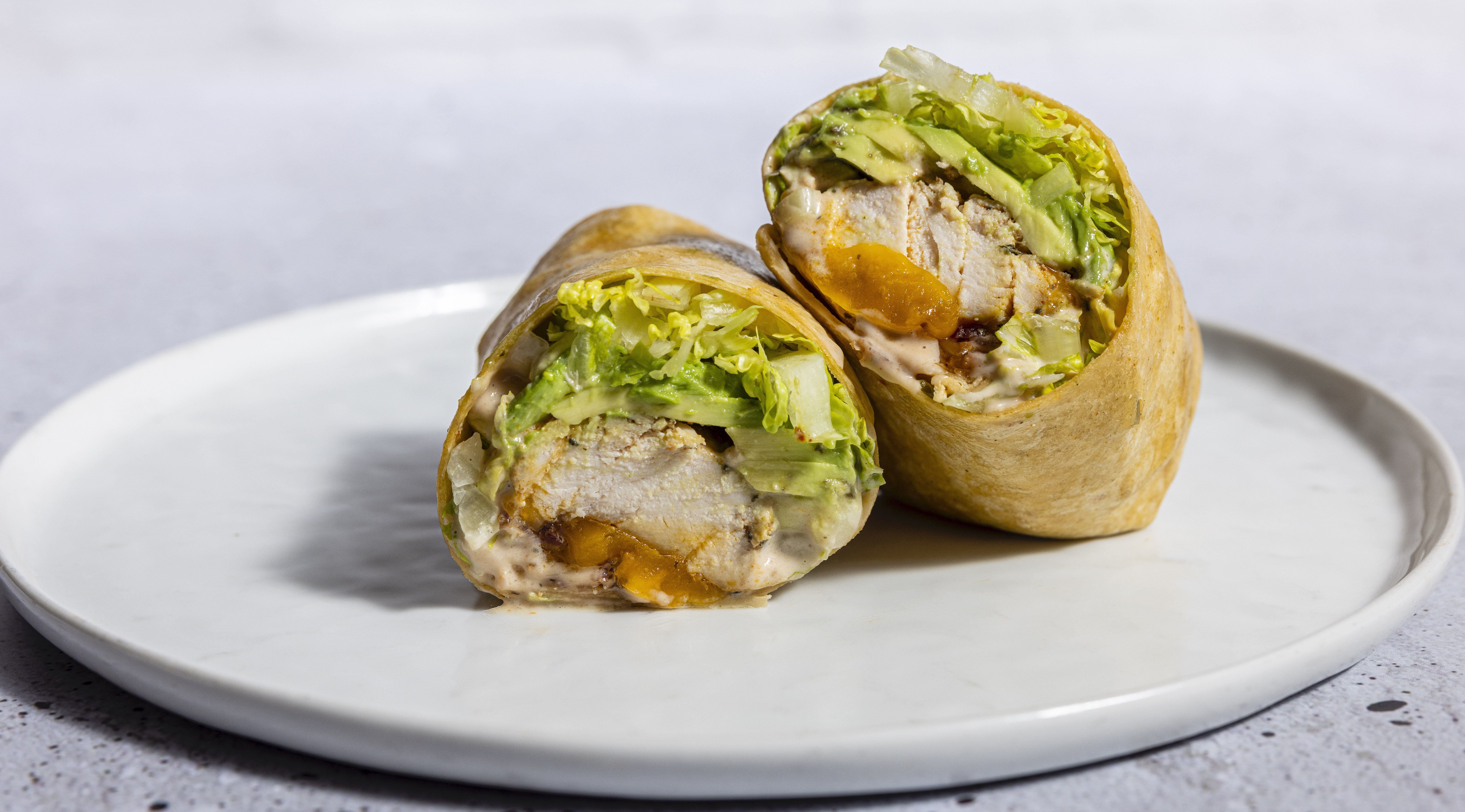 a half eaten sandwich on a plate