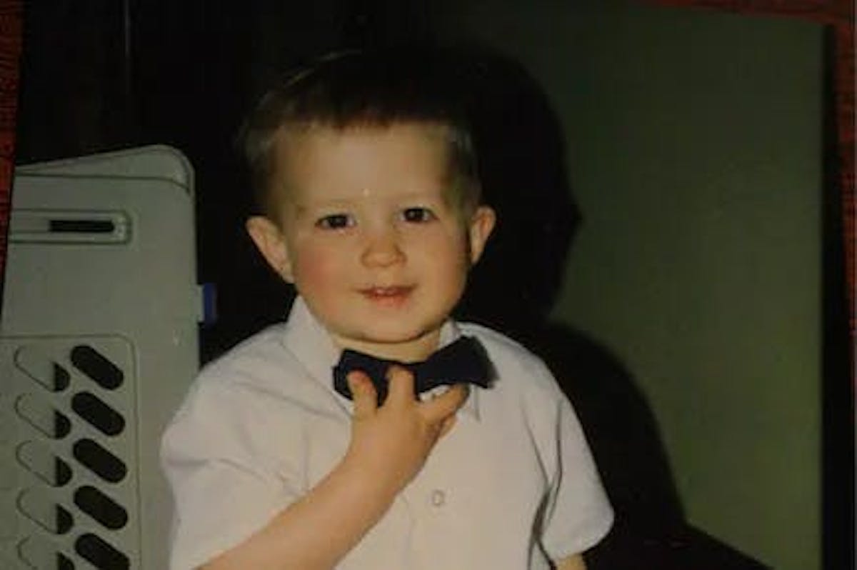 a little boy posing for a picture