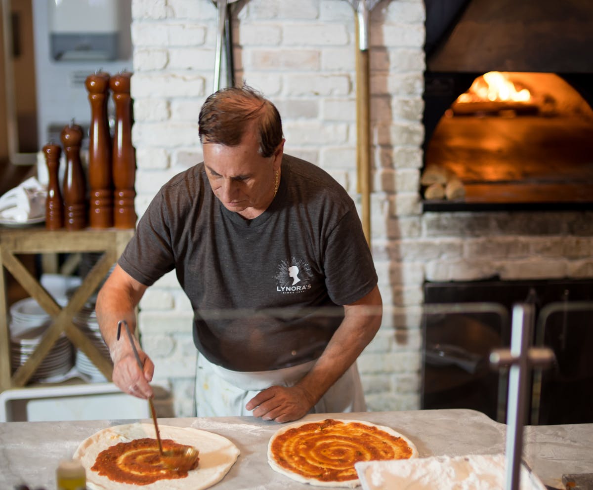 a man cooking food on a table