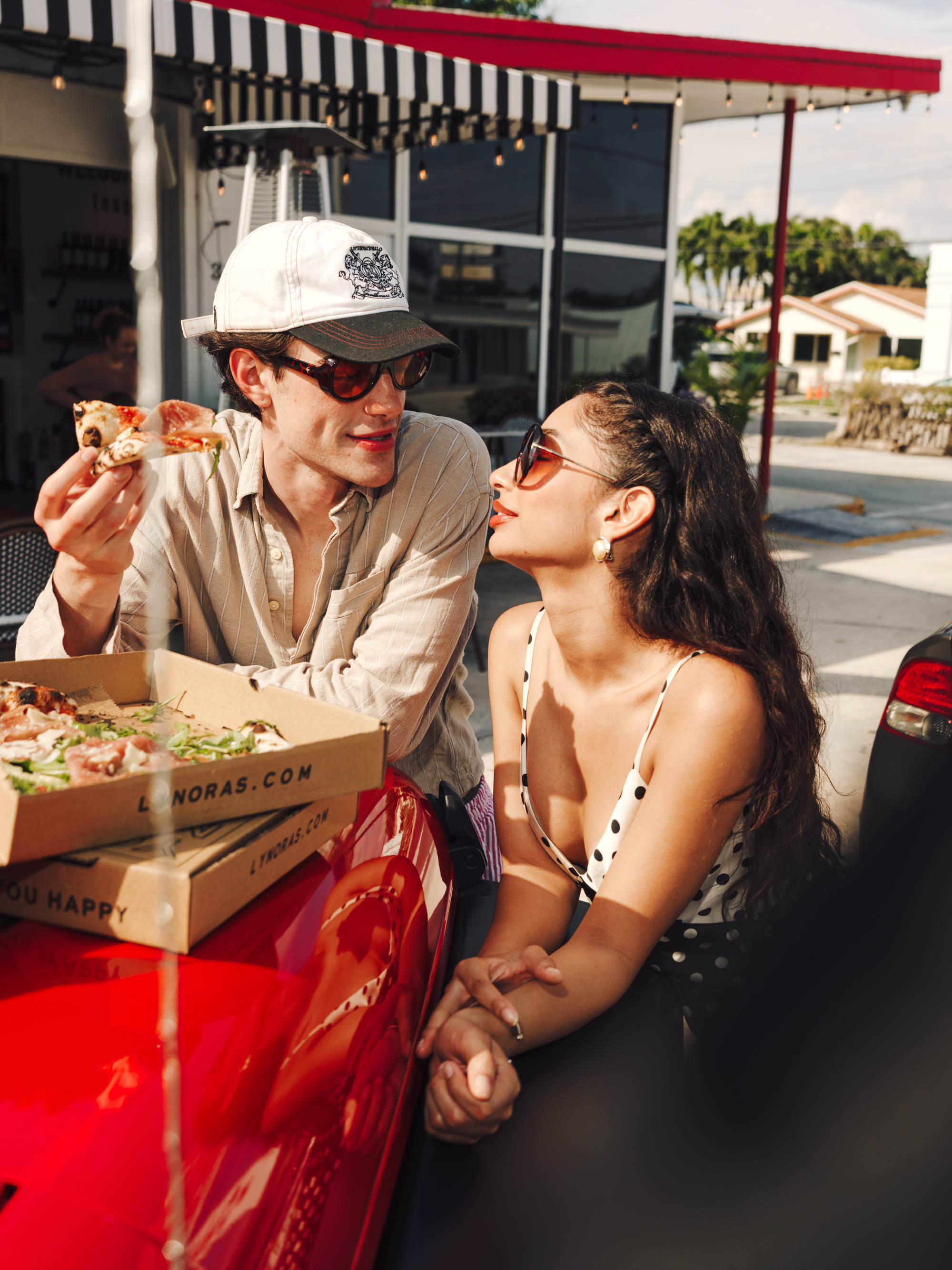People eating Pizza at Lynora’s Kitchen