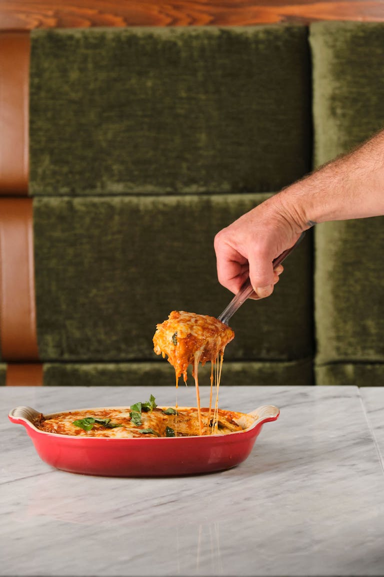 a person holding a bowl of food