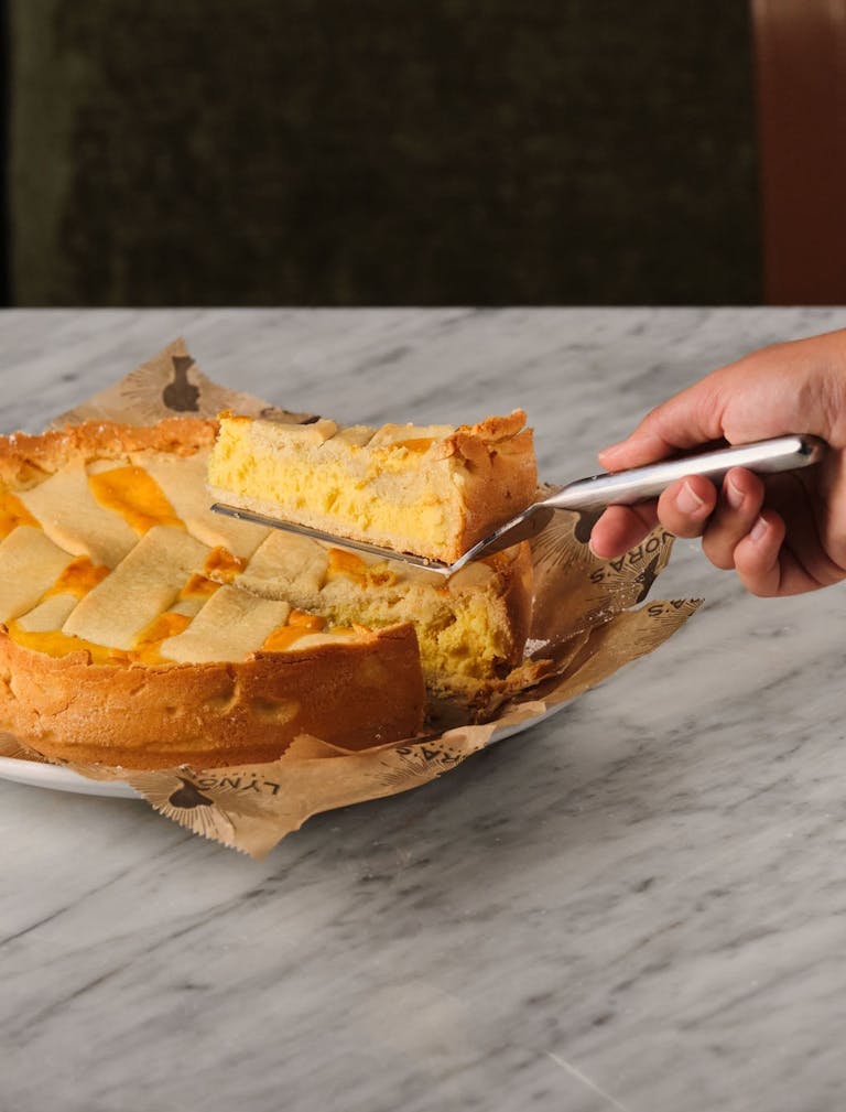 a piece of cake sitting on top of a cutting board