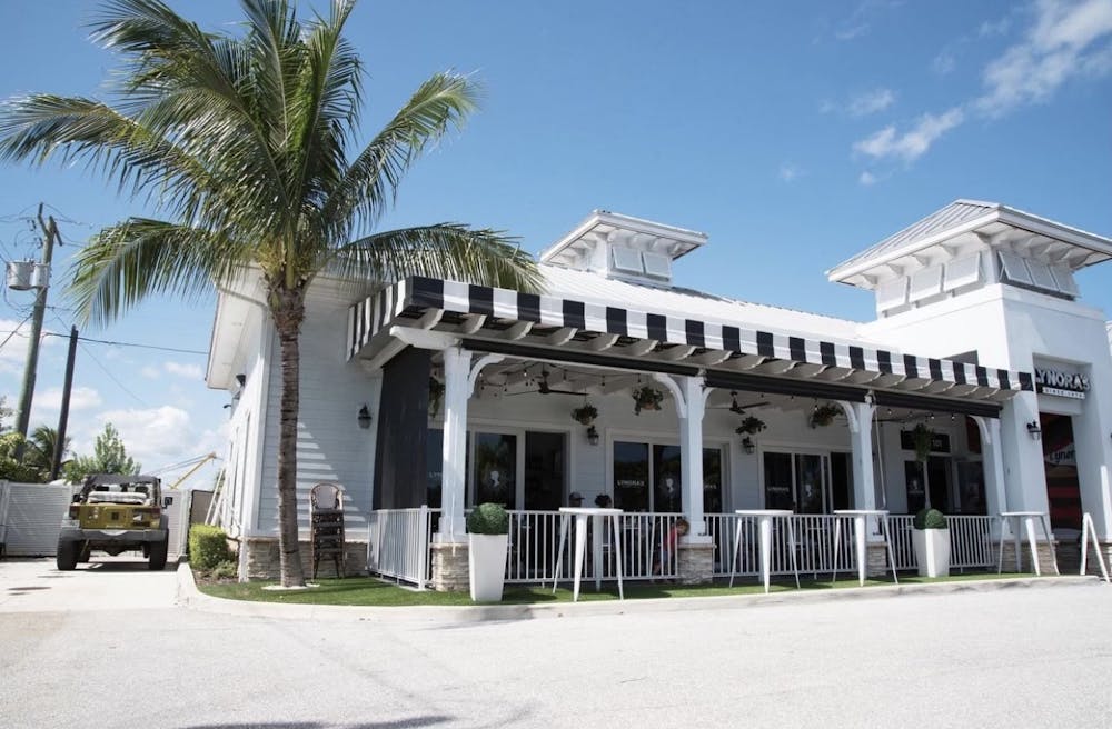 a palm tree in front of a building