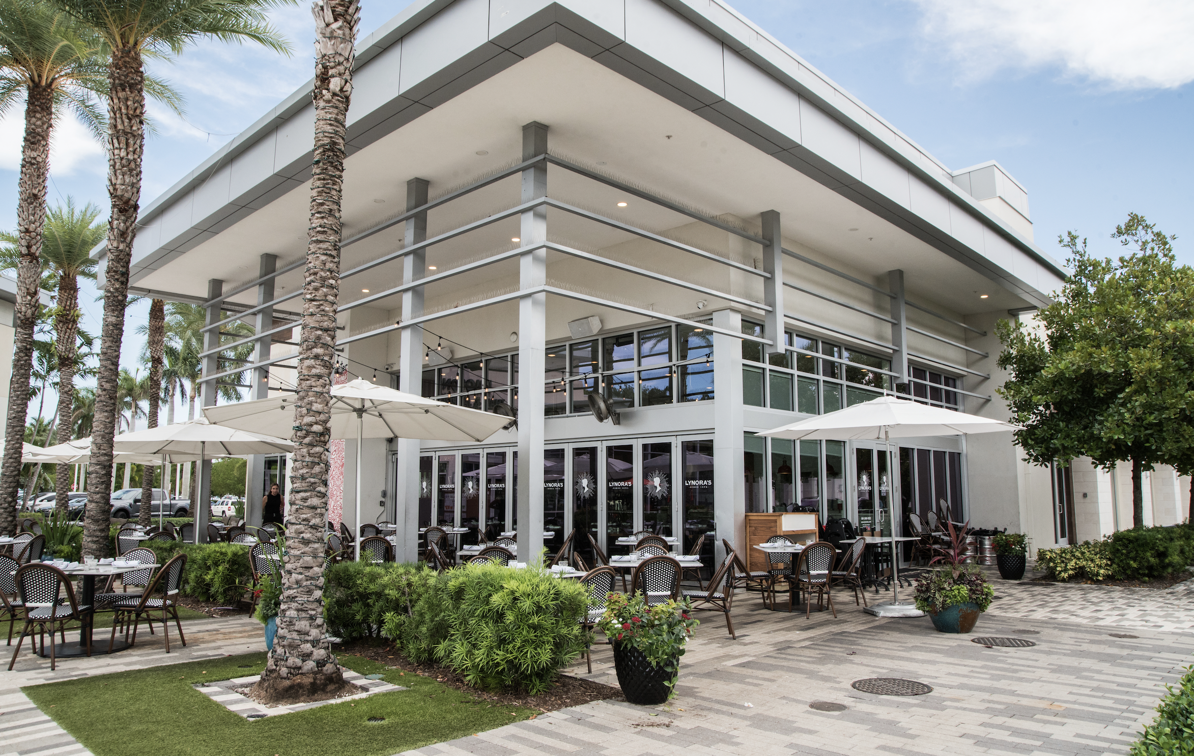 a group of people sitting at a table in a restaurant