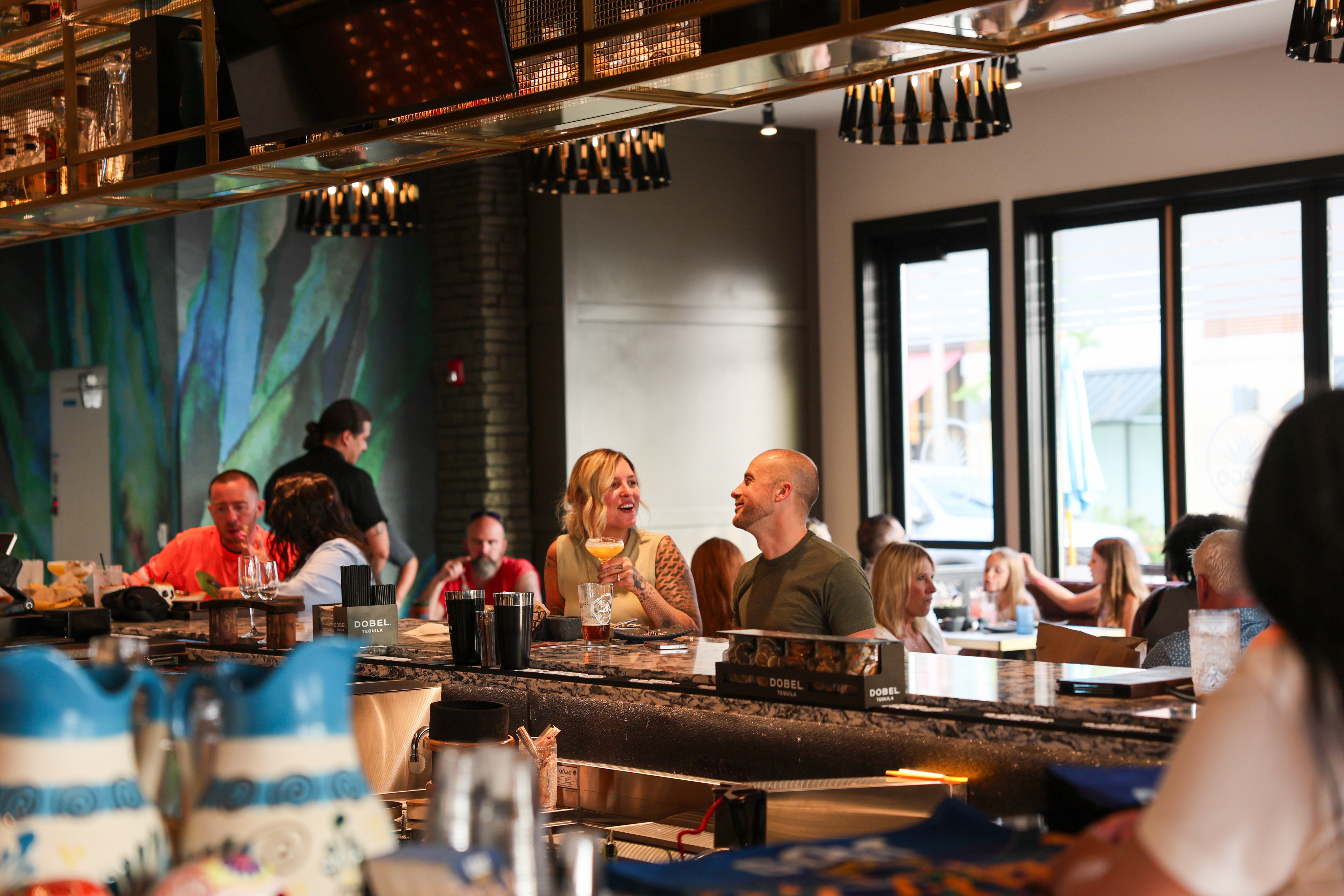 a group of people sitting at a table in a restaurant