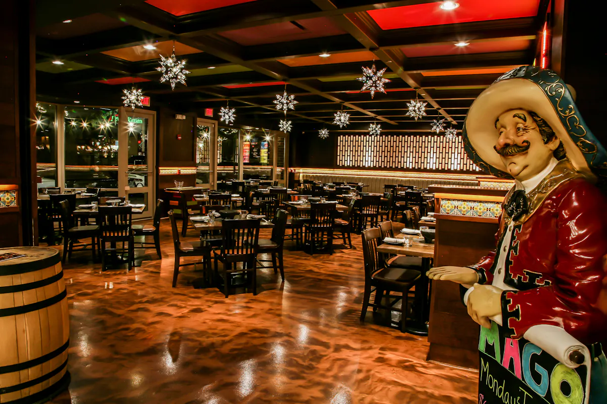 a person sitting at a table in a restaurant