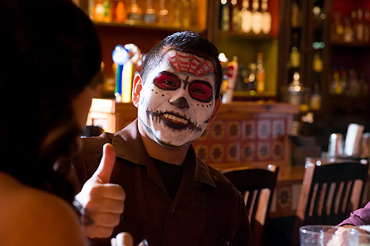 a person sitting at a table in a restaurant