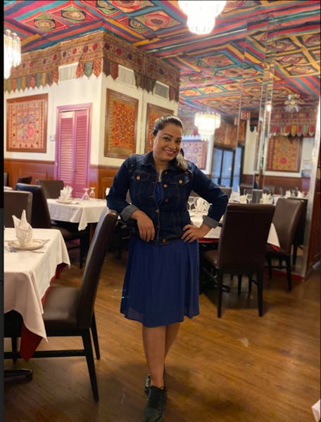a person standing in front of a table