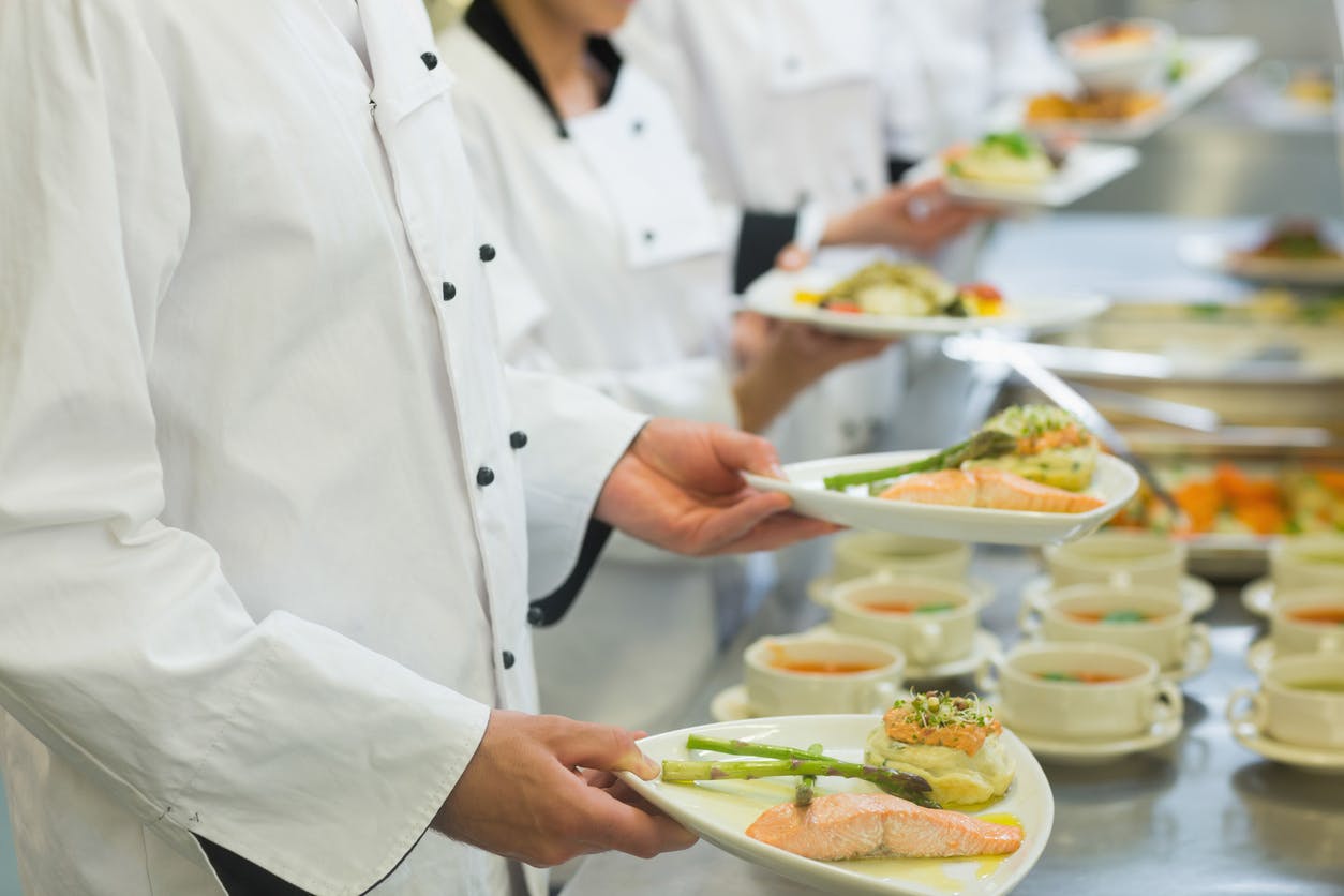 a person preparing food on a table