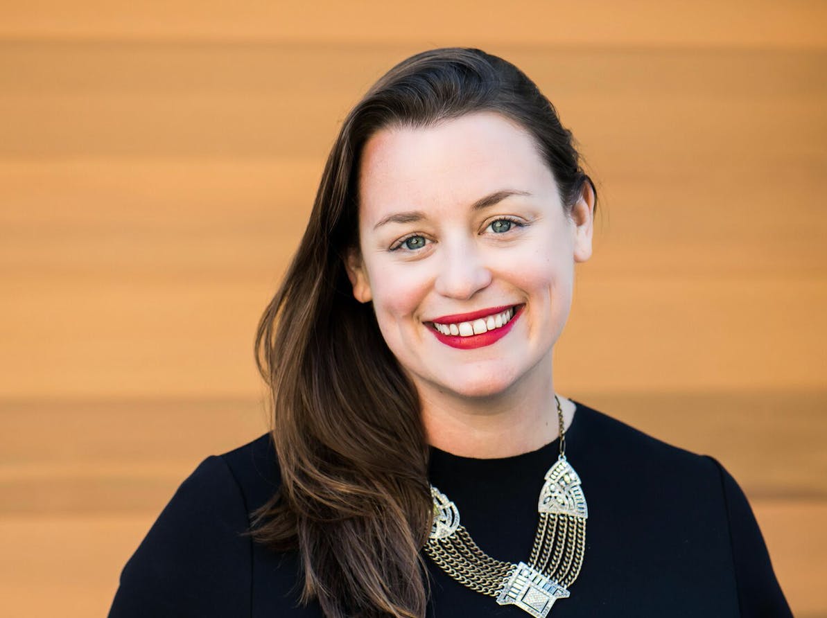 A woman smiling for the camera