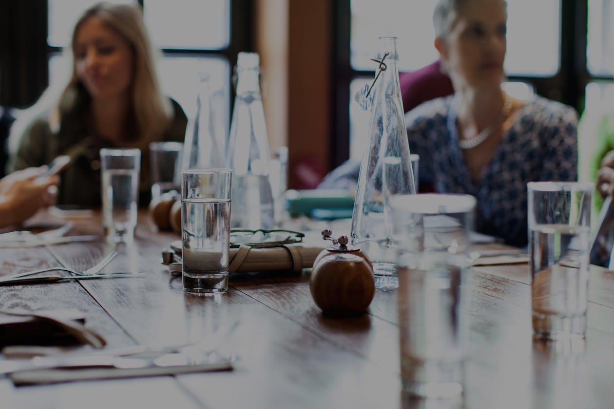 a group of people sitting at a table