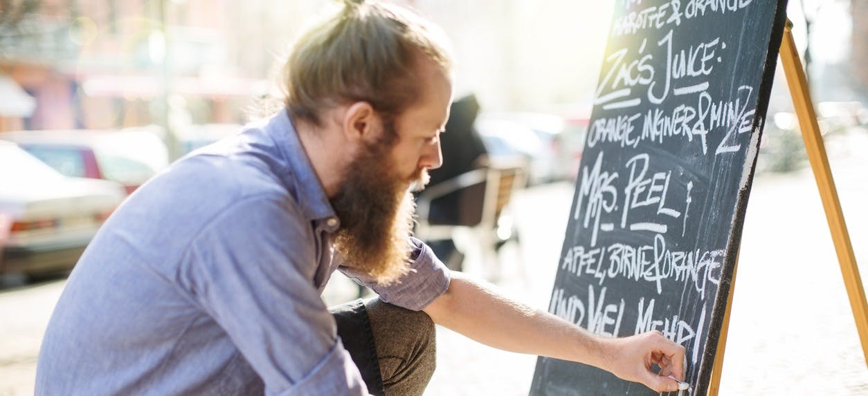 a man holding a sign