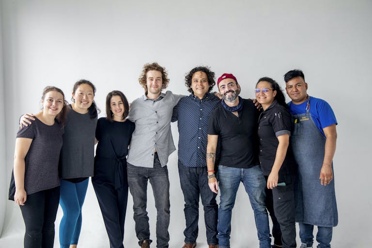 a group of people posing for the camera