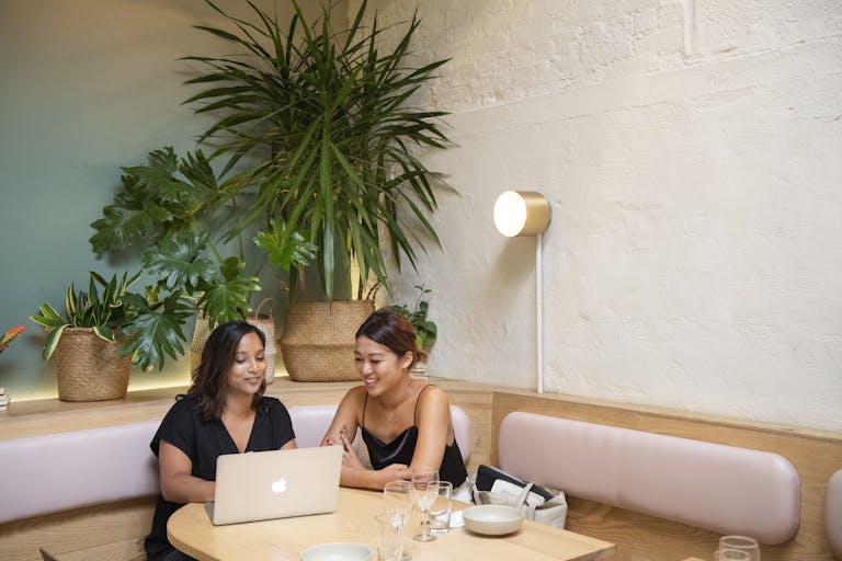 Two women sitting at a table