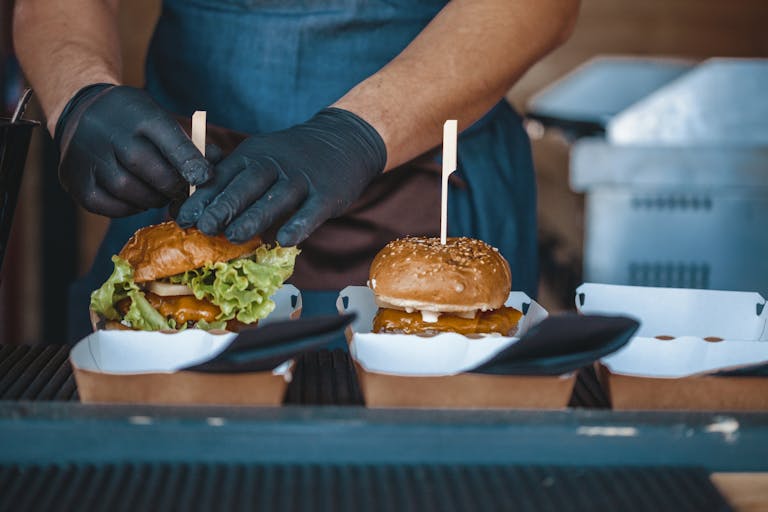 A chef plating to-go food