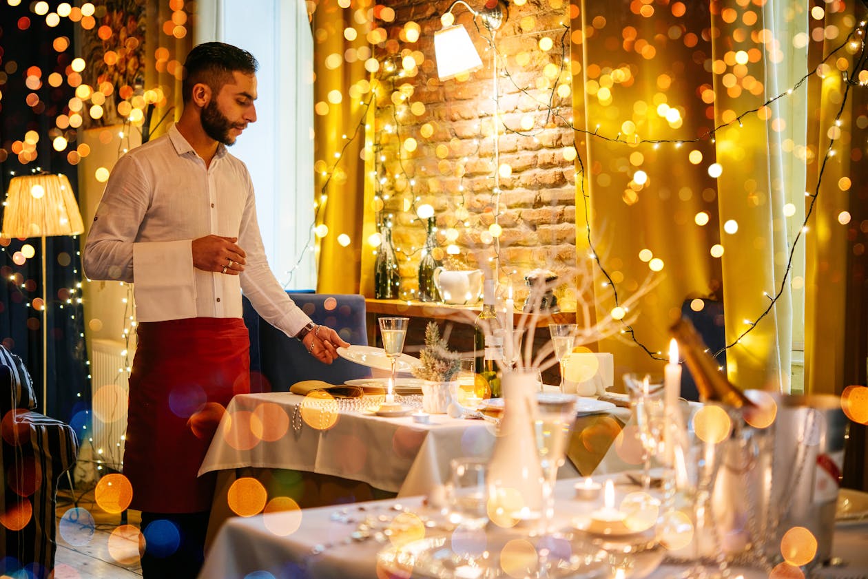 a group of people standing around a table with wine glasses