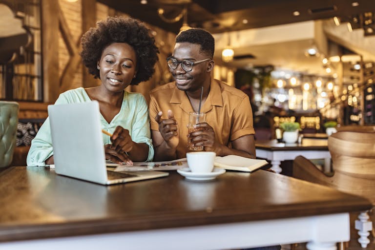 a person sitting at a table in a restaurant