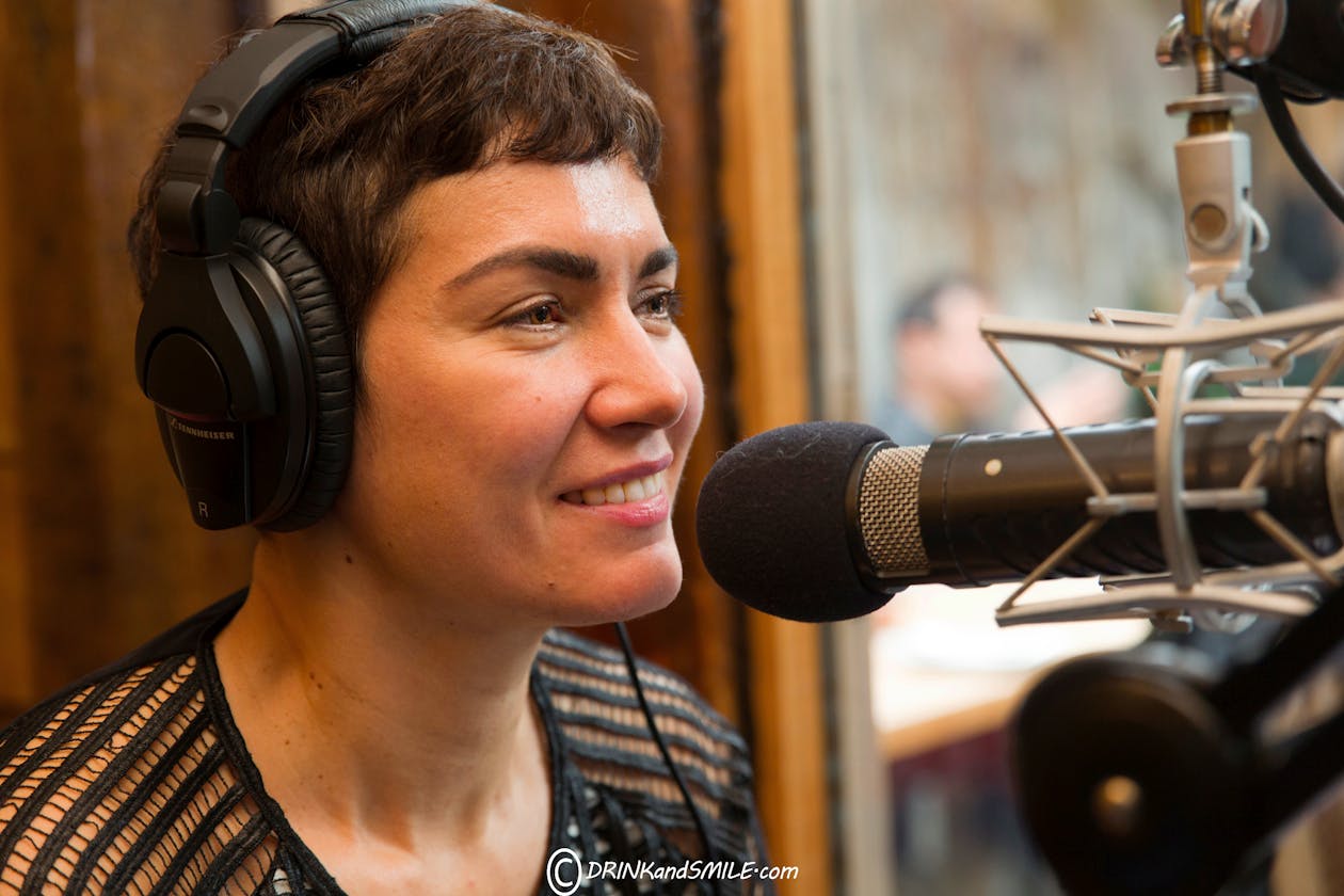 Jennifer Leuzzi talking into a microphone.