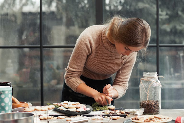 a woman preparing food on a table