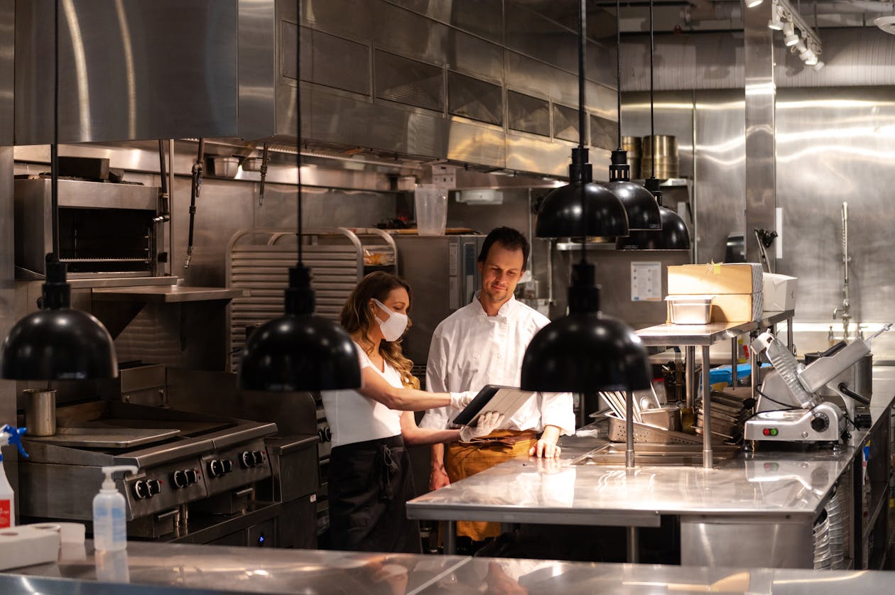 a person cooking in a kitchen preparing food