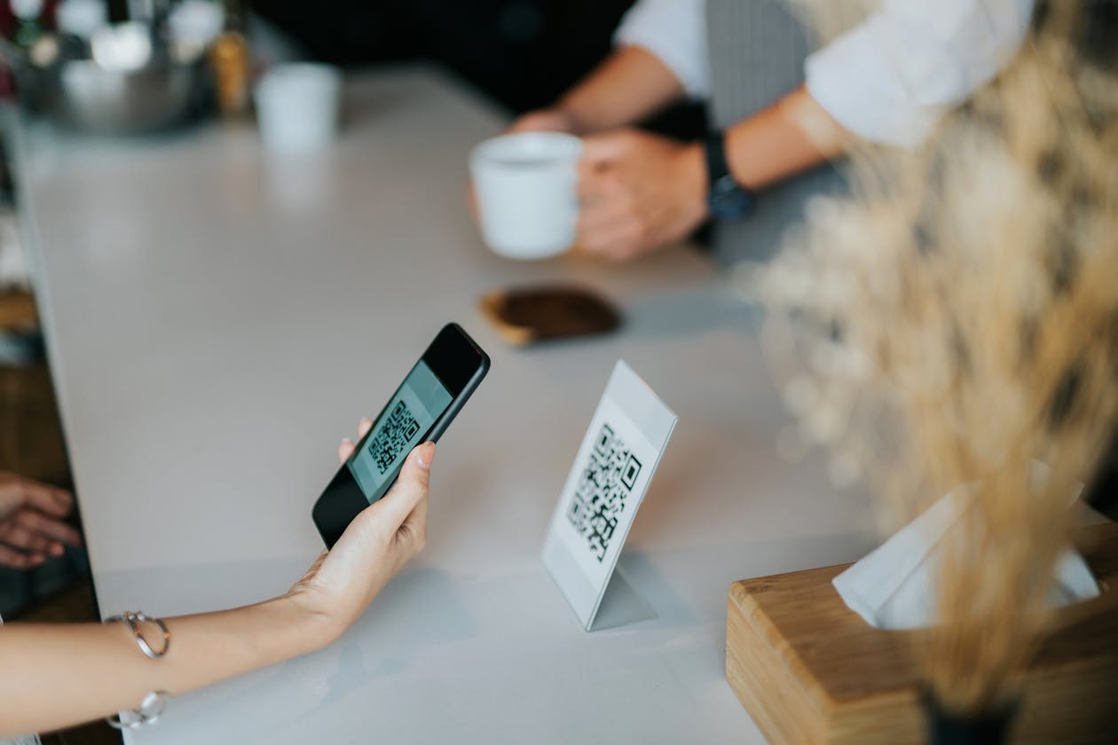 A person using their mobile device to scan a QR code