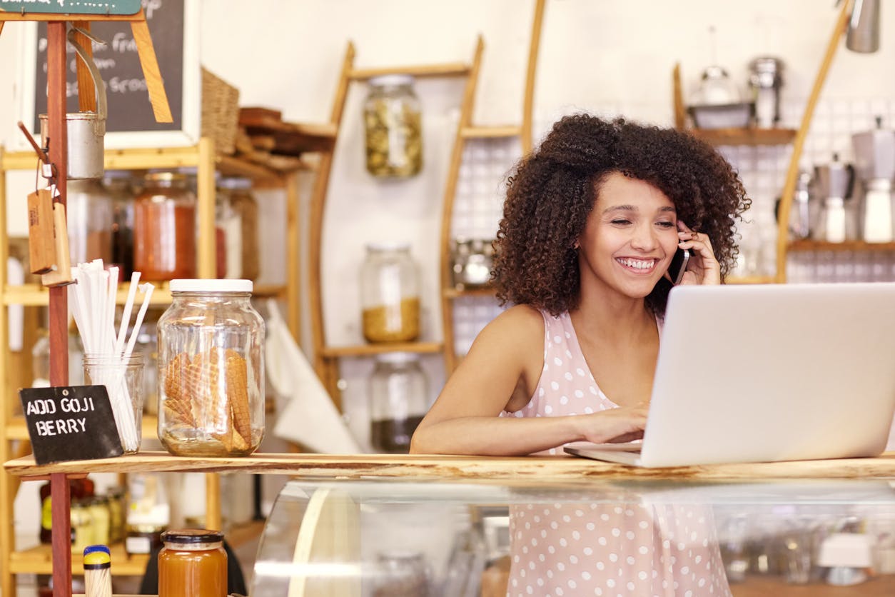 a woman sitting at a table in a restaurant