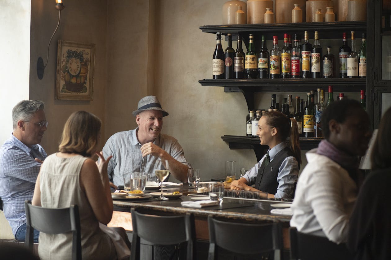 a group of people preparing food in a restaurant