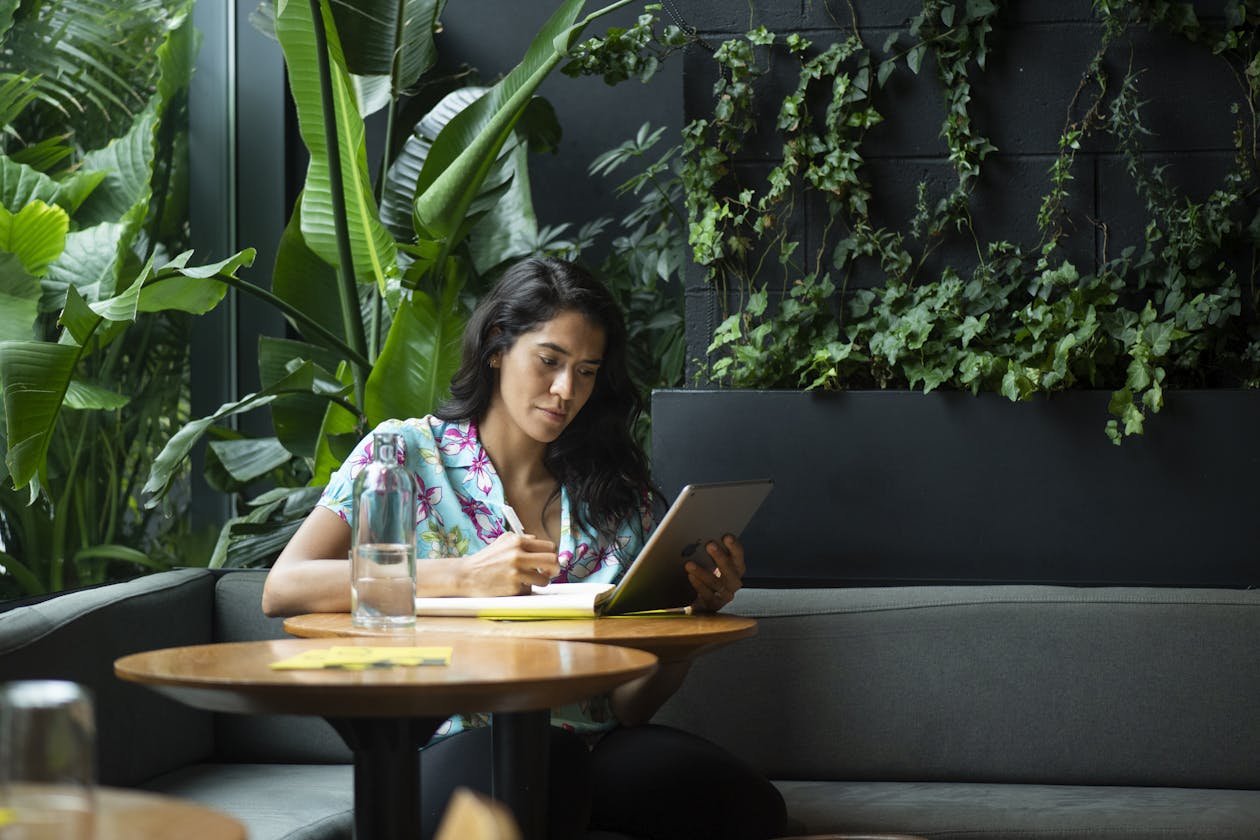 a restaurant own working on an ipad