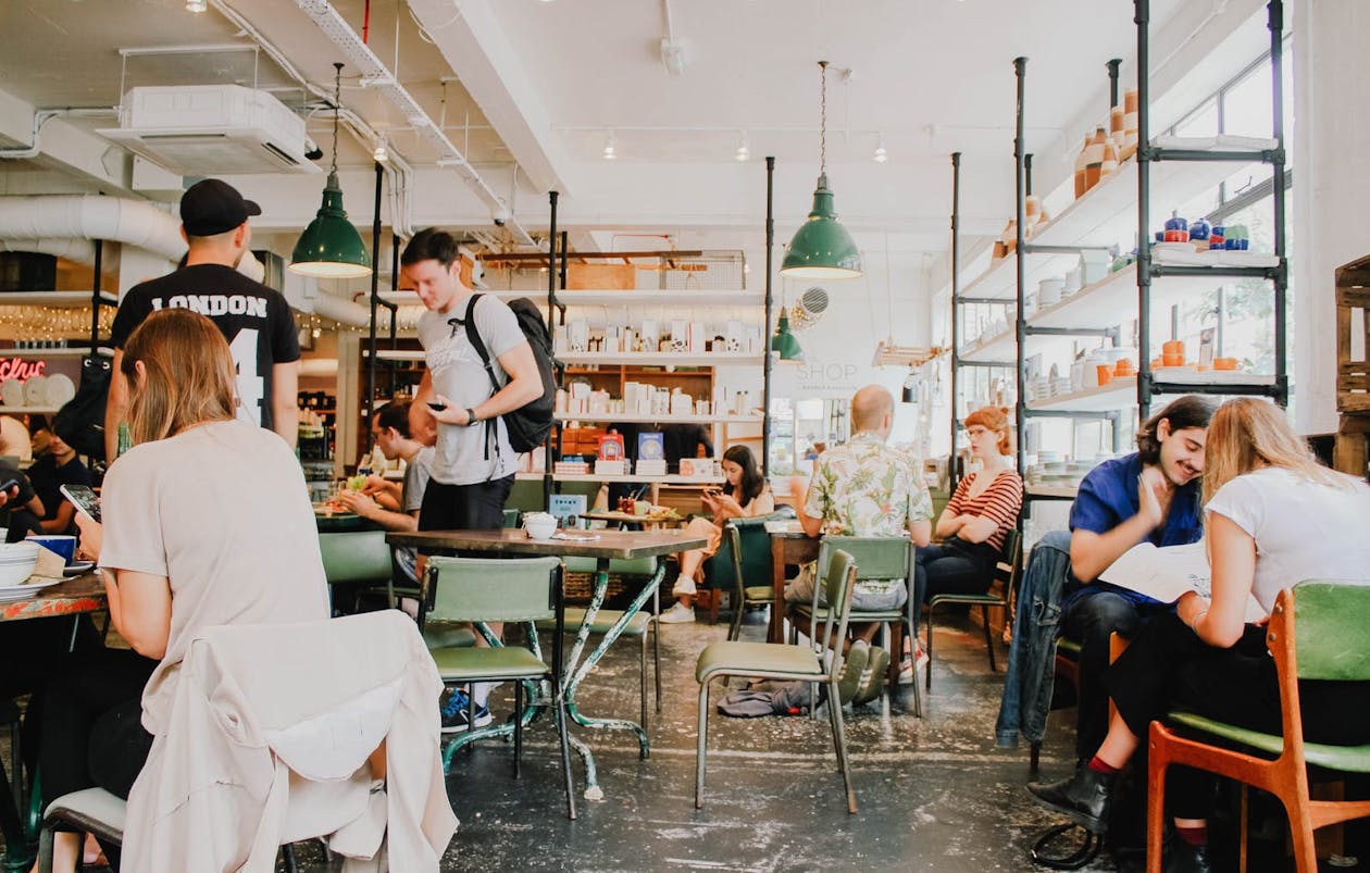 a group of people sitting in a cafe