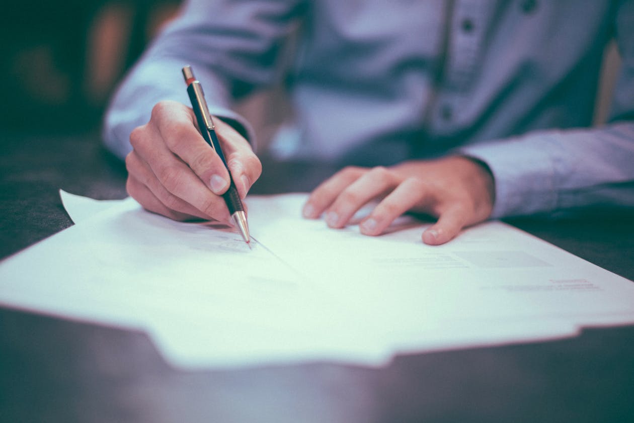 a person signing a contract. 