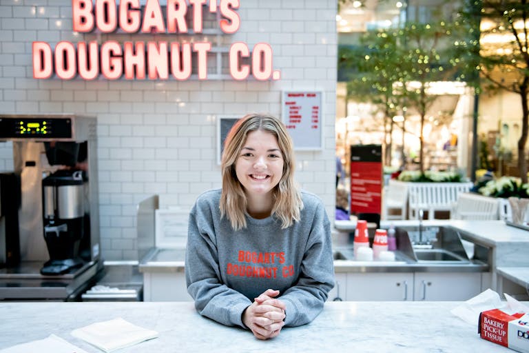 Bogart's Doughnut co. employee wearing branded merchandise