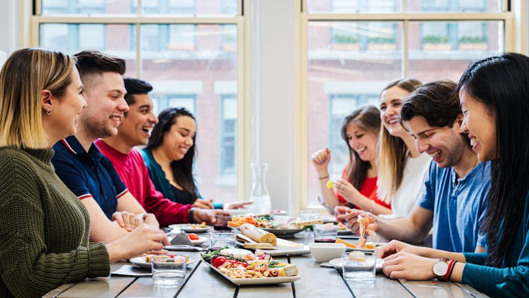 a group of people sitting at a table