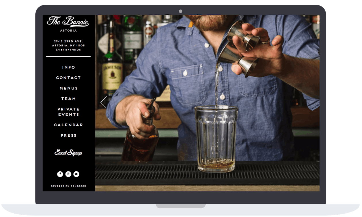 A bartender making a drinking at a bar.