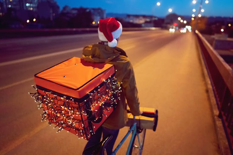 Courier on a bike delivering food
