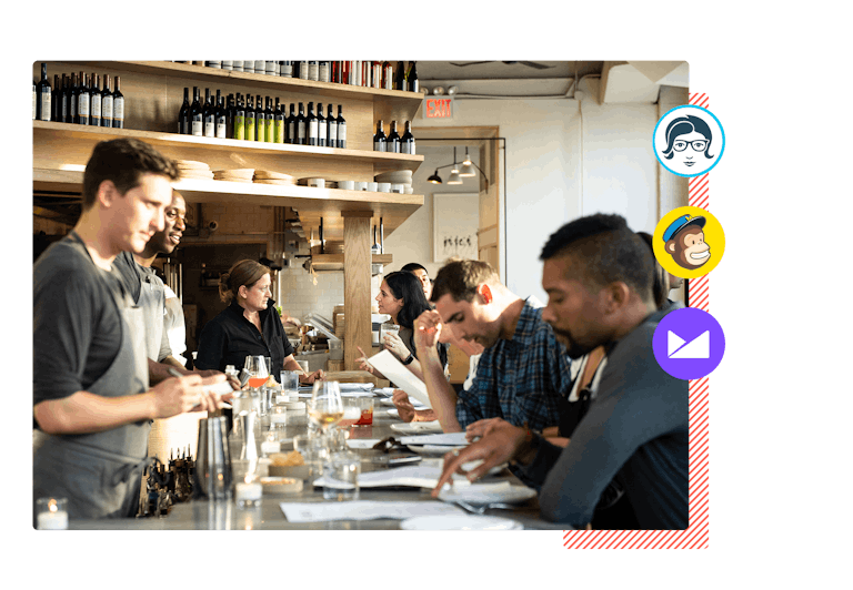 People sitting at a bar and eating