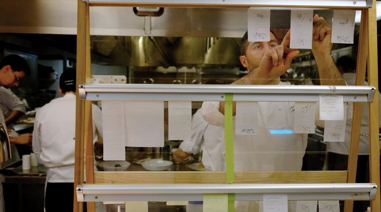 a group of people in a kitchen