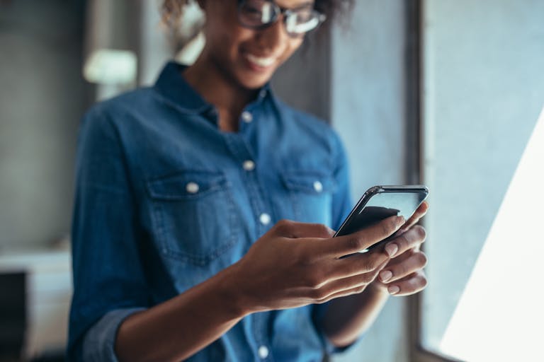 a person is using the cell phone