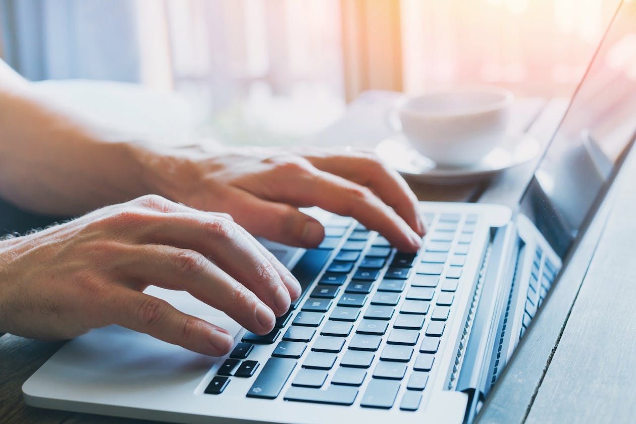 a person using a laptop computer