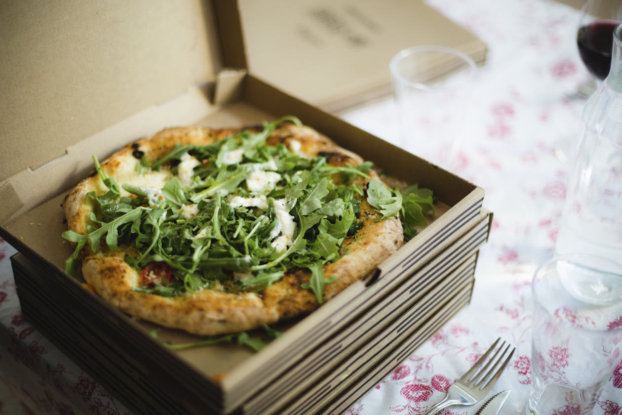 a box of pizza sitting on top of a table