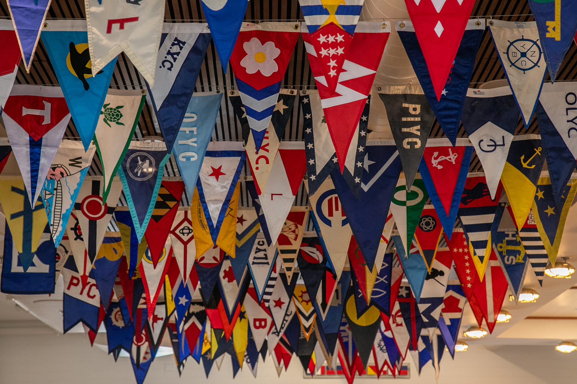 a group of flags from a ceiling