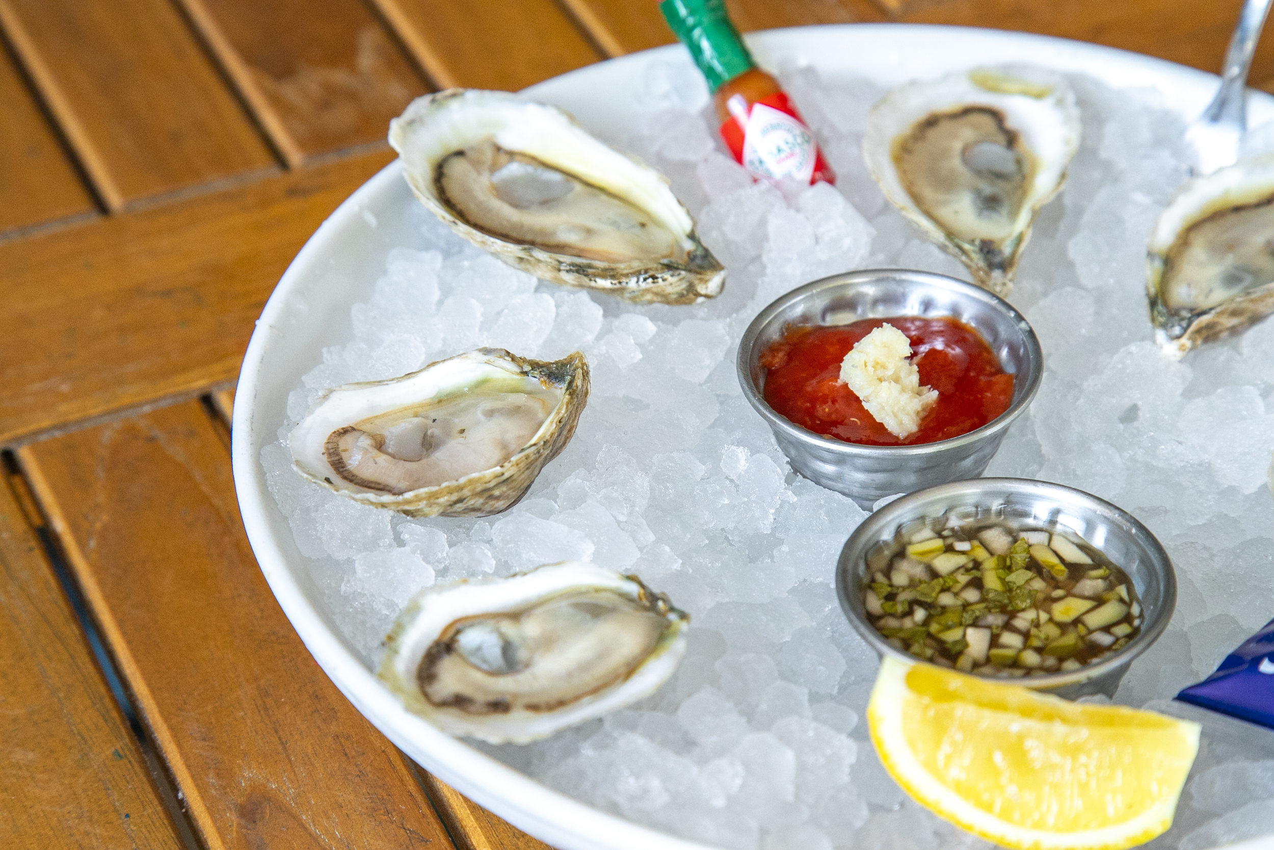 a plate of oysters and sauces