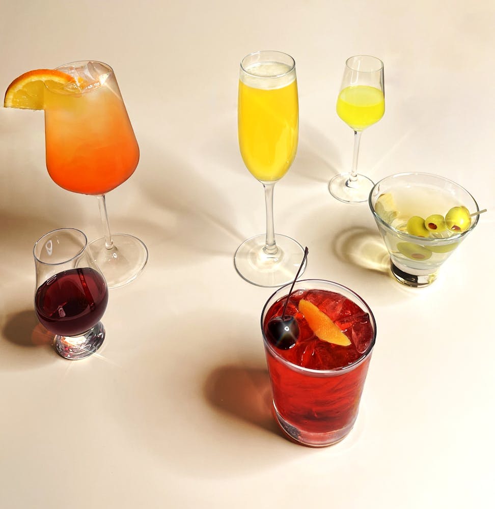 a table topped with glasses of wine
