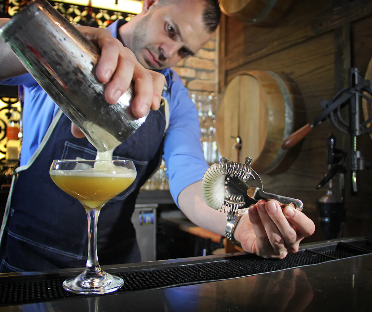 a bartender making a drink