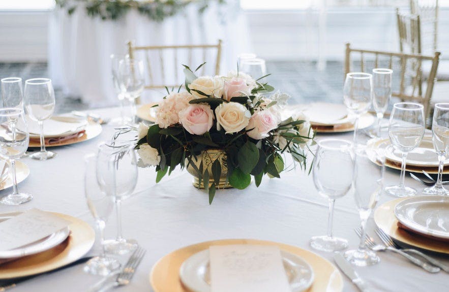 a dining table with wine glasses