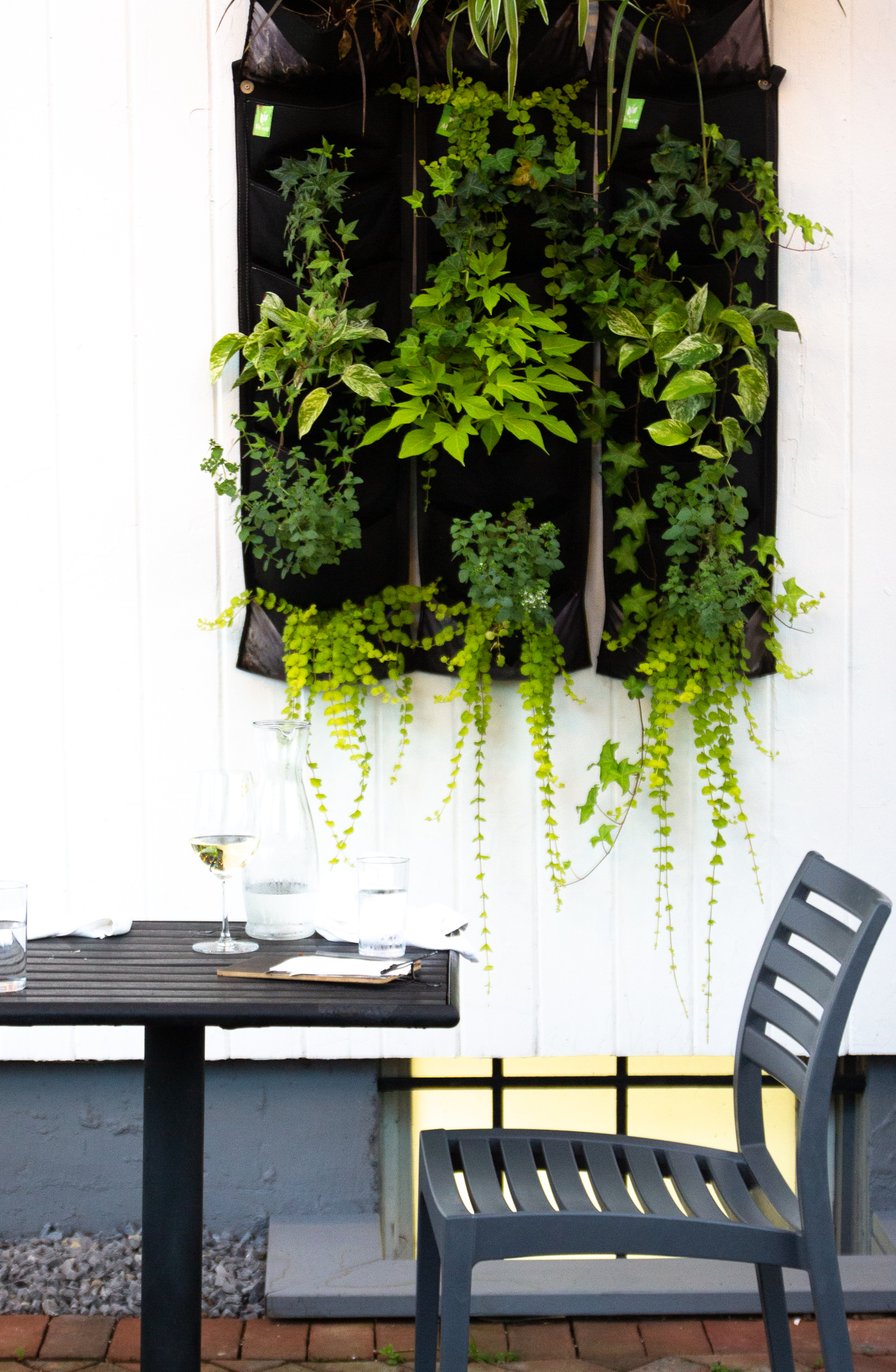 a wooden bench sitting in front of a building